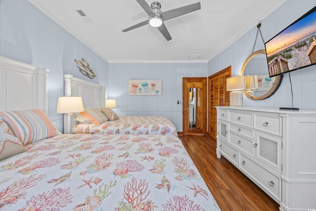 1705 N Ocean Blvd N, North Myrtle Beach, SC 29582 - bedroom featuring dark wood finished floors, crown molding, and a ceiling fan