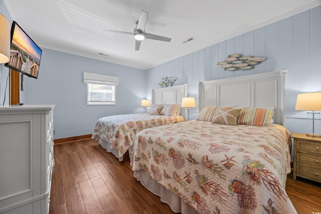 1705 N Ocean Blvd N, North Myrtle Beach, SC 29582 - bedroom featuring baseboards, dark wood-type flooring, a ceiling fan, and crown molding
