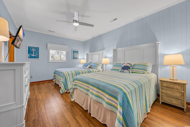 1705 N Ocean Blvd N, North Myrtle Beach, SC 29582 - bedroom with crown molding, hardwood / wood-style floors, ceiling fan, and baseboards