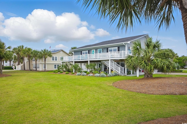 1705 N Ocean Blvd N, North Myrtle Beach, SC 29582 - rear view of property with stairway and a yard