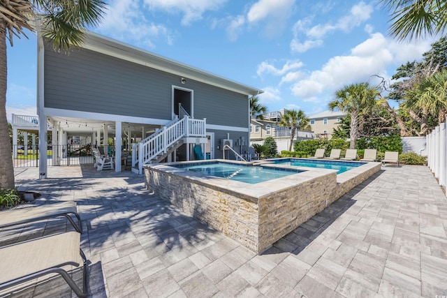 1705 N Ocean Blvd N, North Myrtle Beach, SC 29582 - view of swimming pool featuring stairs, an in-ground hot tub, and a patio area