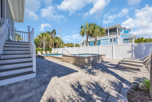 1705 N Ocean Blvd N, North Myrtle Beach, SC 29582 - fenced backyard featuring a jacuzzi, a patio area, and stairway