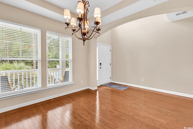 126 Dreamland Dr, Murrells Inlet, SC 29576 - entryway featuring a chandelier, wood finished floors, baseboards, and arched walkways