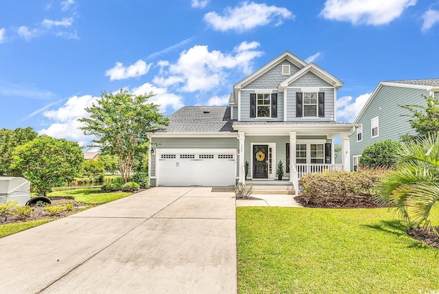 126 Dreamland Dr, Murrells Inlet, SC 29576 - view of front of property with covered porch, a garage, driveway, and a front lawn