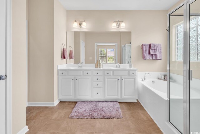 126 Dreamland Dr, Murrells Inlet, SC 29576 - bathroom featuring a garden tub, double vanity, a shower stall, and baseboards
