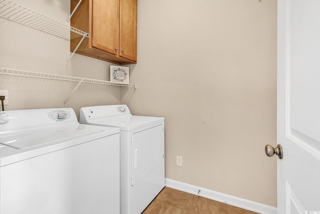 126 Dreamland Dr, Murrells Inlet, SC 29576 - laundry room with separate washer and dryer, cabinet space, baseboards, and light tile patterned floors