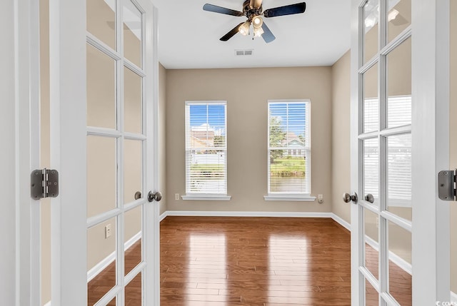 126 Dreamland Dr, Murrells Inlet, SC 29576 - unfurnished room featuring french doors, wood finished floors, ceiling fan, and baseboards