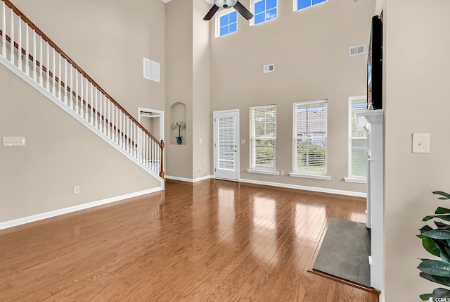 126 Dreamland Dr, Murrells Inlet, SC 29576 - foyer with a ceiling fan, wood finished floors, baseboards, a towering ceiling, and stairs