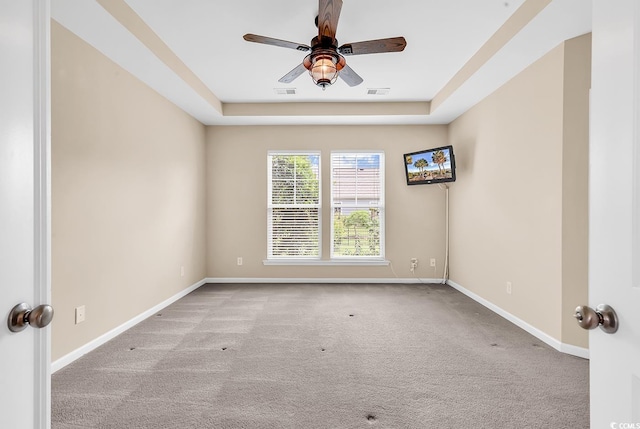 126 Dreamland Dr, Murrells Inlet, SC 29576 - spare room featuring ceiling fan, carpet, baseboards, and a raised ceiling