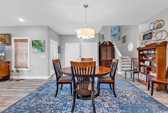 601 46th Ave S, North Myrtle Beach, SC 29582 - dining room featuring baseboards, light wood-type flooring, a chandelier, stairs, and recessed lighting