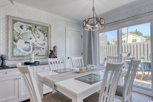 800 S 9th Ave S Unit A-1, North Myrtle Beach, SC 29582 - dining room with crown molding, a chandelier, wallpapered walls, and wood finished floors