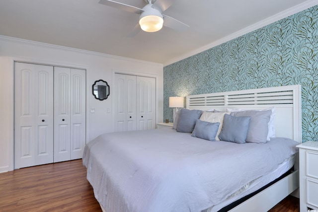 800 S 9th Ave S Unit A-1, North Myrtle Beach, SC 29582 - bedroom with wallpapered walls, multiple closets, ornamental molding, dark wood-style floors, and a ceiling fan