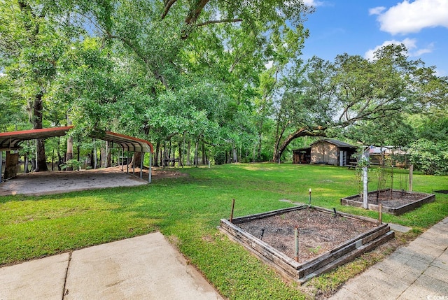 6161 Inman Cir, Conway, SC 29526 - view of grassy yard featuring a garden, a carport, and an outdoor structure