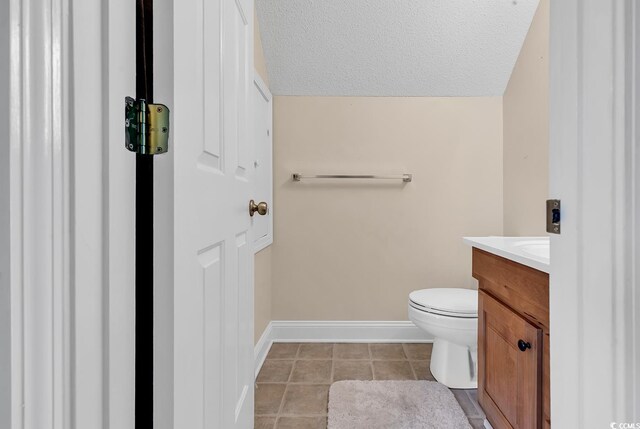 6161 Inman Cir, Conway, SC 29526 - half bathroom featuring vanity, toilet, baseboards, tile patterned flooring, and a textured ceiling