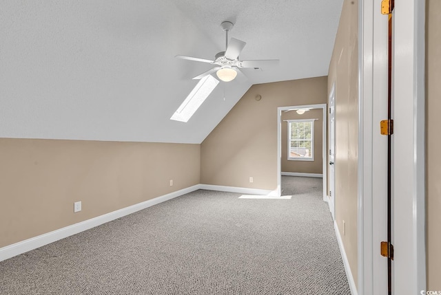 6161 Inman Cir, Conway, SC 29526 - bonus room with ceiling fan, vaulted ceiling, carpet floors, baseboards, and a skylight