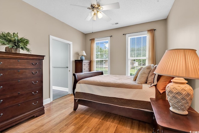 6161 Inman Cir, Conway, SC 29526 - bedroom featuring light wood-style flooring, ceiling fan, and baseboards