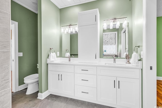 6161 Inman Cir, Conway, SC 29526 - bathroom featuring double vanity, toilet, ornamental molding, and baseboards