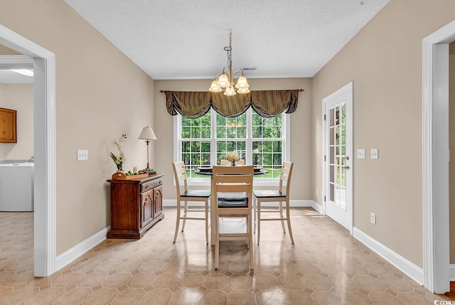 6161 Inman Cir, Conway, SC 29526 - dining space featuring washer / dryer, a chandelier, a textured ceiling, and baseboards