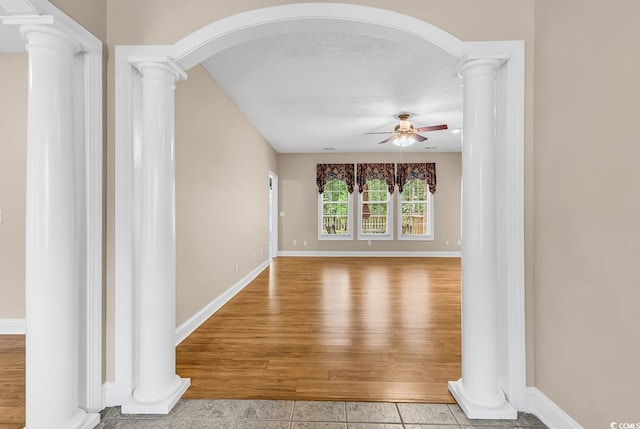 6161 Inman Cir, Conway, SC 29526 - hall with decorative columns, arched walkways, baseboards, and wood finished floors