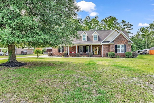 6161 Inman Cir, Conway, SC 29526 - view of front of house featuring a porch, brick siding, and a front lawn