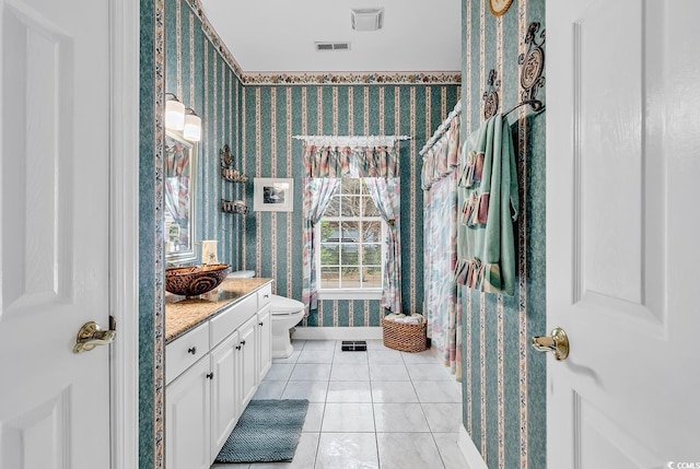 383 Oatland Lake Rd, Pawleys Island, SC 29585 - bathroom featuring wallpapered walls, vanity, toilet, and tile patterned floors