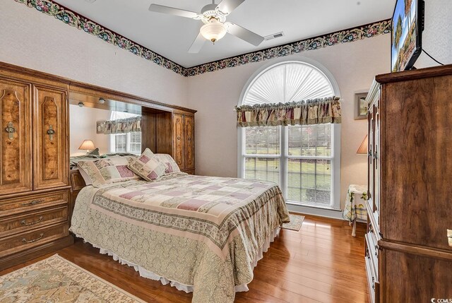 383 Oatland Lake Rd, Pawleys Island, SC 29585 - bedroom featuring wood finished floors and ceiling fan