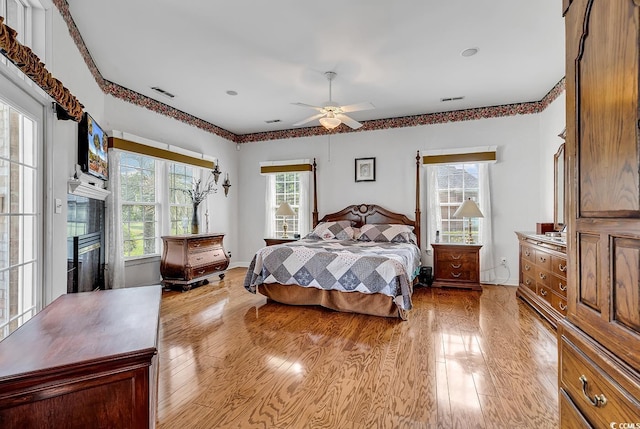 383 Oatland Lake Rd, Pawleys Island, SC 29585 - bedroom featuring light wood-type flooring and ceiling fan