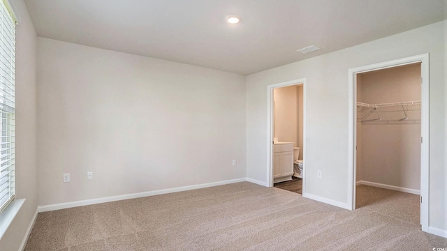 575 Strawberry Field Way, Galivants Ferry, SC 29544 - unfurnished bedroom featuring carpet floors, a spacious closet, a closet, ensuite bath, and recessed lighting