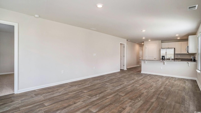 575 Strawberry Field Way, Galivants Ferry, SC 29544 - unfurnished living room with dark wood-type flooring and recessed lighting