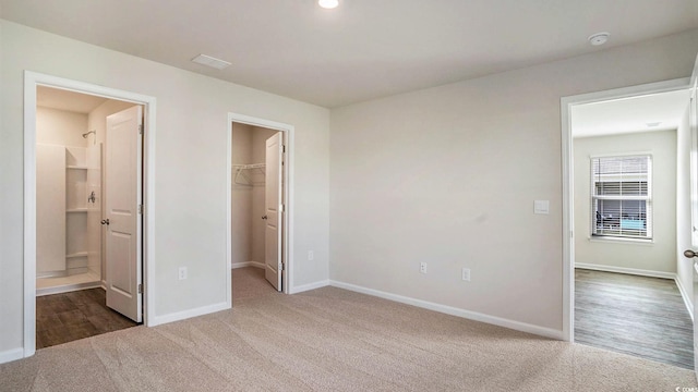 575 Strawberry Field Way, Galivants Ferry, SC 29544 - unfurnished bedroom with carpet, a walk in closet, a closet, and ensuite bathroom