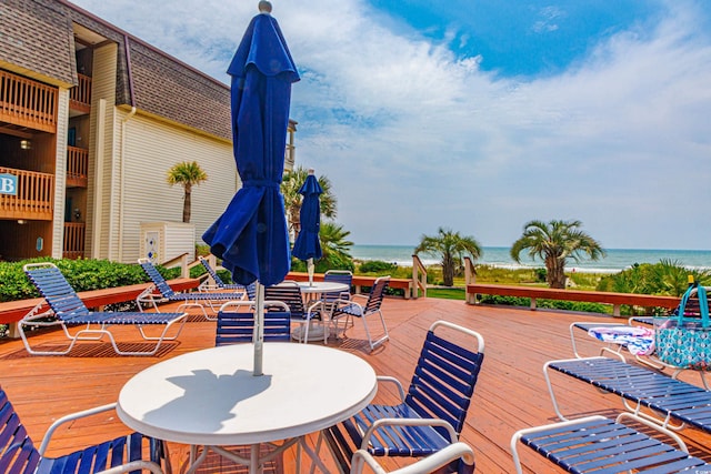 5601 N Ocean Blvd Unit A-307, Myrtle Beach, SC 29577 - wooden deck featuring outdoor dining area and a water view