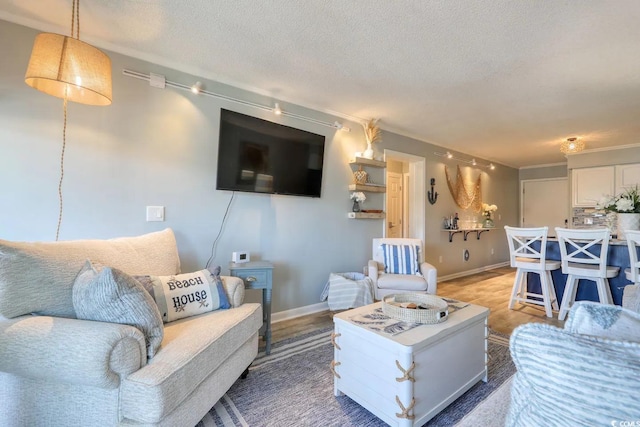5601 N Ocean Blvd Unit A-307, Myrtle Beach, SC 29577 - living room with a textured ceiling and baseboards