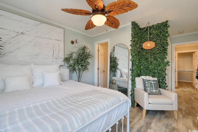 5601 N Ocean Blvd Unit A-307, Myrtle Beach, SC 29577 - bedroom with wood finished floors, crown molding, and a ceiling fan