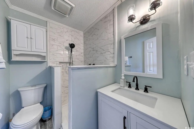 5601 N Ocean Blvd Unit A-307, Myrtle Beach, SC 29577 - full bathroom featuring a tile shower, a textured ceiling, toilet, vanity, and crown molding