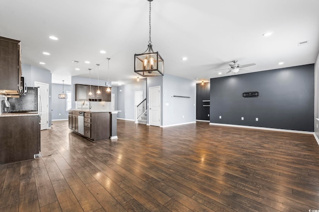 4115 Alvina Way, Myrtle Beach, SC 29579 - unfurnished living room featuring a ceiling fan, dark wood-type flooring, recessed lighting, baseboards, and a chandelier