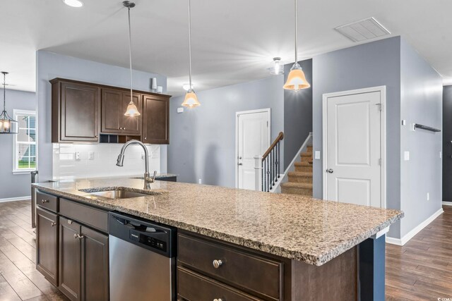 4115 Alvina Way, Myrtle Beach, SC 29579 - kitchen with stainless steel dishwasher, a sink, dark wood-style floors, baseboards, and dark brown cabinets