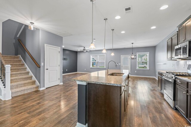 4115 Alvina Way, Myrtle Beach, SC 29579 - kitchen featuring stainless steel appliances, a sink, dark brown cabinets, dark wood-style flooring, and recessed lighting