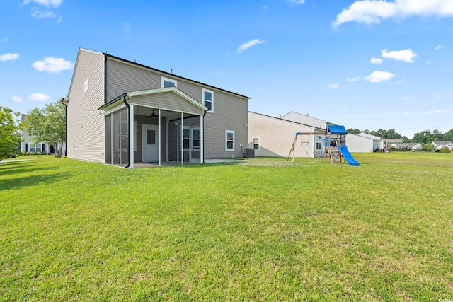 4115 Alvina Way, Myrtle Beach, SC 29579 - rear view of house with a playground, a sunroom, a yard, and central AC unit