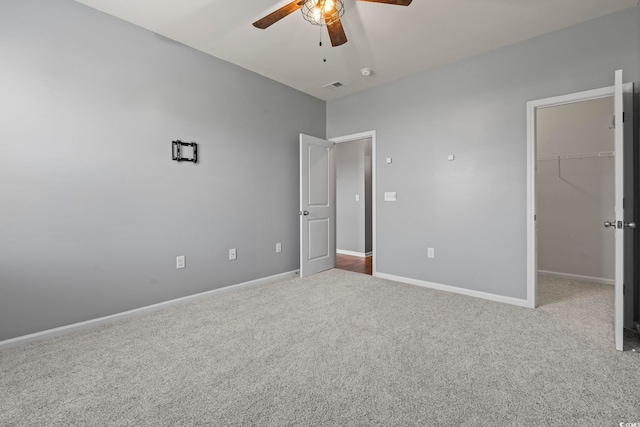 4115 Alvina Way, Myrtle Beach, SC 29579 - unfurnished bedroom with carpet, a spacious closet, baseboards, a closet, and ceiling fan