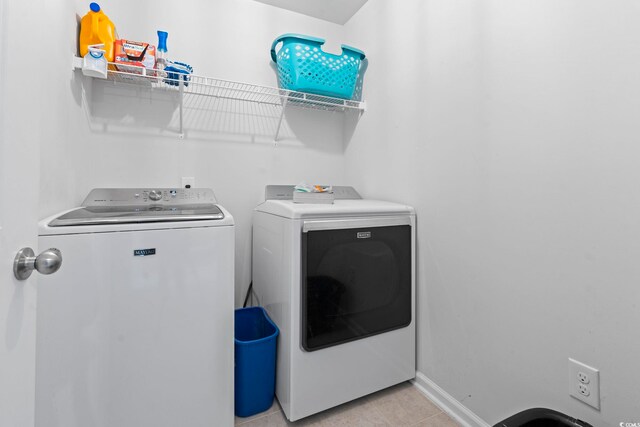 4115 Alvina Way, Myrtle Beach, SC 29579 - laundry room with separate washer and dryer, baseboards, and light tile patterned flooring