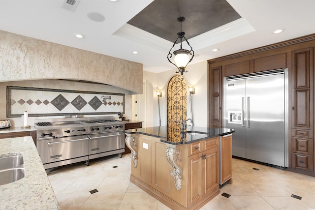 2715 Ships Wheel Dr, North Myrtle Beach, SC 29582 - kitchen featuring premium appliances, a sink, light stone countertops, light tile patterned floors, and recessed lighting