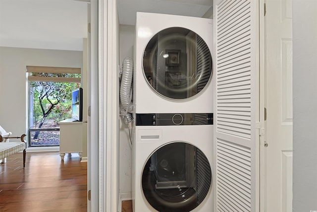 88 Salt Marsh Cir Unit 22F, Pawleys Island, SC 29585 - laundry room featuring stacked washing machine and dryer, wood finished floors, and baseboards