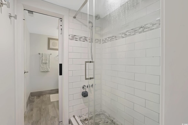 88 Salt Marsh Cir Unit 22F, Pawleys Island, SC 29585 - full bathroom with wood finished floors, a stall shower, and baseboards