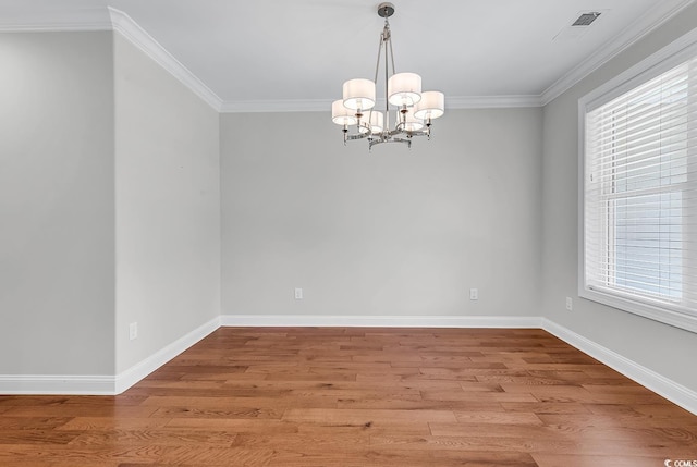 133 Deloach Trl, Pawleys Island, SC 29585 - empty room with light wood finished floors, a chandelier, ornamental molding, healthy amount of natural light, and baseboards