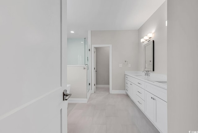 133 Deloach Trl, Pawleys Island, SC 29585 - full bathroom featuring double vanity, recessed lighting, baseboards, and a shower with shower door