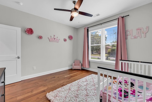 133 Deloach Trl, Pawleys Island, SC 29585 - bedroom with wood finished floors, baseboards, and ceiling fan