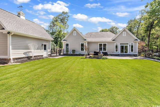 133 Deloach Trl, Pawleys Island, SC 29585 - back of house with a patio, a shingled roof, and a chimney