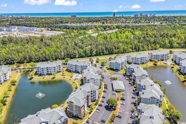 4820 Magnolia Lake Dr Unit 305, Myrtle Beach, SC 29577 - bird's eye view of a nearby body of water, apartment complex / building, and a tree filled landscape