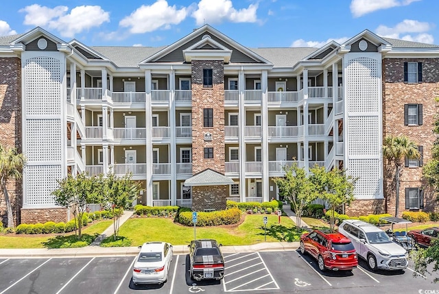 4820 Magnolia Lake Dr Unit 305, Myrtle Beach, SC 29577 - view of building exterior featuring uncovered parking