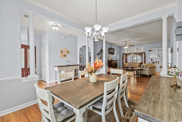 29 Saltwind Loop, Murrells Inlet, SC 29576 - dining space with ornate columns, ceiling fan, wood finished floors, crown molding, and a chandelier
